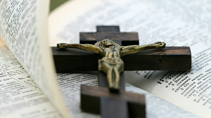 Cross on Bible